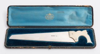 A Victorian silver cucumber cutter in the form a saw, maker Atkin Brothers, Sheffield,