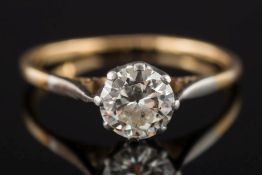 A gold and diamond solitaire ring: the circular, old-cut diamond 6.2mm diameter x 3.