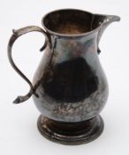 A George II silver sparrow beak cream jug, maker's mark worn possibly I.