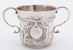 A Queen Anne Britannia standard silver porringer, makers mark worn ?O with pellet below,