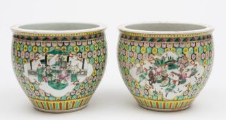 A pair of Chinese famille rose small fish bowls: painted with panels of officials and warriors on a
