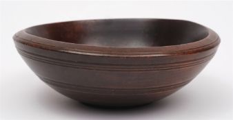 A late 18th/early 19th century turned wood bowl: of plain form with reeded girdle, 27.5cm.