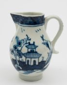 A Lowestoft blue and white 'sparrow-beak' cream jug: painted with a chinoiserie lake landscape with