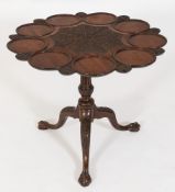 A 19th Century carved mahogany occasional table:, in the Chippendale taste,