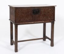 An early 18th century oak rectangular box: on a later stand, having a plain hinged top,