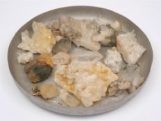 A collection of various examples of quartz crystal from Oman.