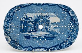 Three unattributed pearl glazed transfer decorated blue and white strainers: of oval form,