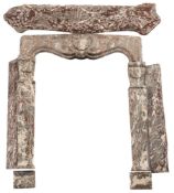 A grey and white variegated marble fire surround: with shell decorated frieze between curved stiles,