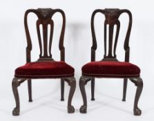 A pair of George II carved mahogany dining chairs:,