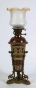 A Mettlach pottery and brass mounted oil lamp: of ovoid tapering form,