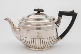 A Victorian silver teapot, maker's mark worn *B JH?, London, 1866: crested and inscribed,