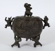 A Chinese bronze tripod censer and cover: of circular form, the pierced cover with figural finial,