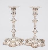 A pair of George II cast silver candlesticks, maker John Cafe, London,