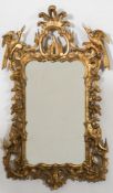 A 19th century carved giltwood wall mirror: of cartouche-shaped outline with palmette and ho-ho