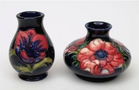 A Moorcroft pottery vase and one later example: the former of squat form,