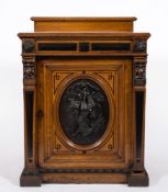 A late Victorian oak ebonised and bronzed mounted pedestal cellarette cupboard:,