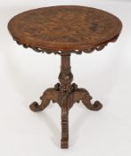A Victorian carved walnut and parquetry circular occasional table:,