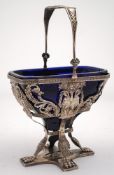 A 19th century German silver swing-handled basket: of rectangular outline with canted corners,