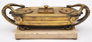 A 19th century French gilt brass desk stand: of barge shaped outline,