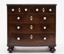 An apprenticeman's early 19th century mahogany bow-fronted chest: with reel turned mouldings and