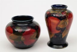Two Moorcroft pottery vases: one of baluster form,