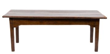 An 18th century oak dining table: with a rectangular triple plank top on square section rounded