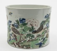 A large Chinese famille verte brushpot: of waisted cylindrical form, painted with birds,