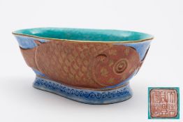 A Chinese porcelain 'two carp' dish: of footed pear shaped form,