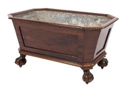A Victorian mahogany wine cooler: of sarcophagus shape with a moulded edge and zinc lined interior