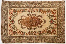 A Kirman rug:,