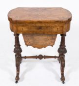 A Victorian walnut and inlaid combined games and work table:, bordered with boxwood lines,