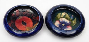 Two Moorcroft pottery small dishes: of circular form, tubelined in the Pansy pattern in pink, blue,