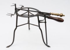 A late 18th/early 19th century polished steel and brass lark spit: the circular trivet stand with