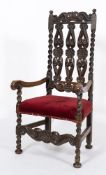 A 17th century and later carved oak open armchair::,