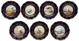 A set of seven Coalport cabinet plates: each of shaped circular form with moulded rim,