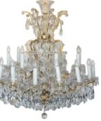 A glass and brass chandelier:, the upper tier with eight branches, the lower with sixteen,