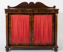 A Regency rosewood chiffonier:, with a shaped ledge back and beaded frieze,