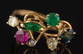A diamond, emerald, ruby and sapphire seven stone ring: of various shapes and size, ring size M 1/2.