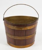 A hardwood and brass bound swing handled elliptical bucket:,