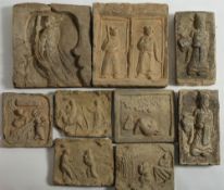 A group of nine Chinese earthenware tiles: variously moulded in relief with warriors,