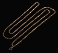 A late 19th century 9ct gold guard chain: of plain oval links, 148cm long,