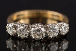 A gold and diamond five-stone ring: with graduated circular brilliant-cut diamonds estimated to
