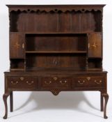 A late 18th century oak and mahogany crossbanded and inlaid dresser:,