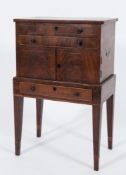An early 19th Century mahogany and inlaid shell collector's cabinet:, bordered with boxwood lines,