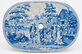 A pearl glazed transfer decorated blue and white strainer: of oval form decorated in the Beemaster