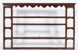 The 18th Century oak shelved superstructure from a dresser:, with a moulded cornice,