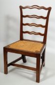 A set of five early 19th Century mahogany ladderback dining chairs:,