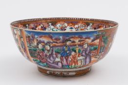 A Chinese porcelain small punch bowl: decorated in the rich Mandarin palette with panels of ladies