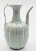 A Chinese Qingbai porcelain wine ewer: of melon shaped form with raised flaring neck,