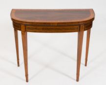 An early 19th Century rosewood, satinwood crossbanded and inlaid card table:, of D shaped outline,